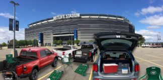 A tailgate party is shown outside of a stadium after leaving a New Jersey Kia dealership.