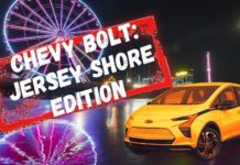 An orange Chevy Bolt EV is shown at a New Jersey electric car dealer.