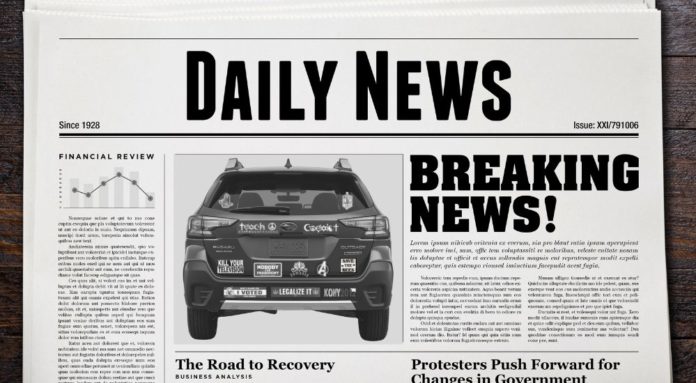 A daily news paper shows an article about a woman who bought a vehicle at a New Jersey Subaru Outback dealer.