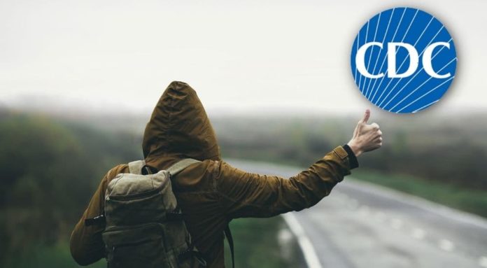 A hitchhiker is shown from behind with the CDC logo above them.