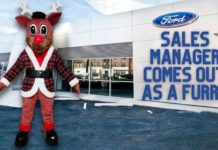 A sales manager dressed as a reindeer furry is shown standing in front of a Certified Pre-Owned Ford F-150 dealer.