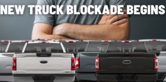 Multiple 2022 Ford F-150's are shown from behind forming a blockade.
