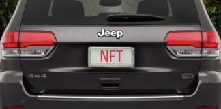 A grey 2022 Jeep Grand Cherokee WK is shown from the rear with a license plate that spells NFT.