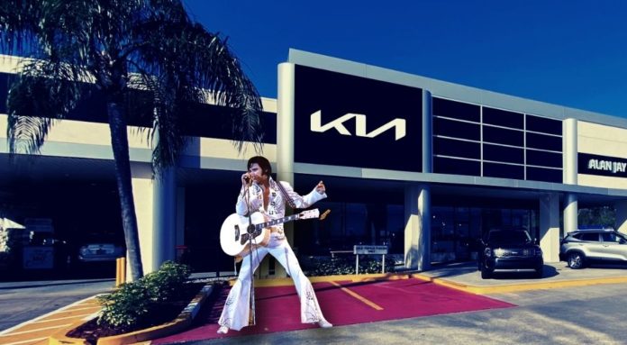 Elvis is shown standing outside of a King of Prussia Kia dealership.