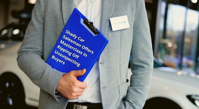 A salesman is shown holding a clipboard while trying to convince you to sell your car.