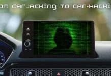 The infotainment screen of a car is shown with a hacker on it.