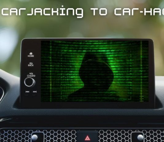 The infotainment screen of a car is shown with a hacker on it.