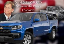 David Duke is shown behind a blue 2022 Chevy Colorado and a black 2022 Nissan Frontier after someone searched '2022 Nissan Frontier vs 2022 Chevy Colorado'.