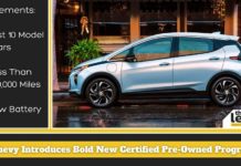A blue 2022 Chevy Bolt is shown from the side after leaving a Certified Chevy dealer.