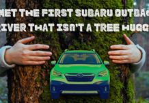 A green 2022 Subaru Outback is shown from the front in front of a tree after leaving a Subaru Outback dealer.