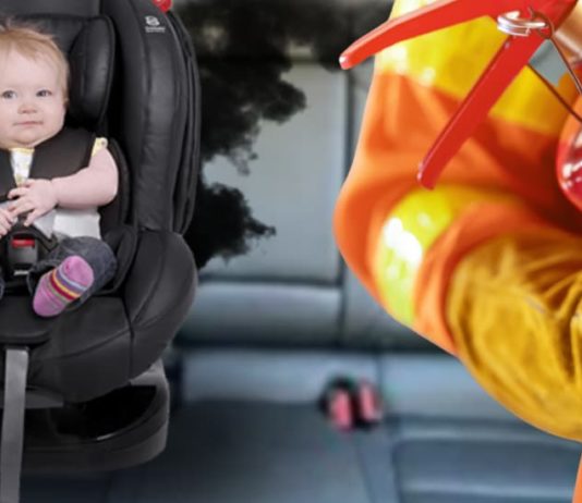 A baby in a carseat is shown in a Bolt EV next to a fireman.