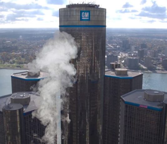 The GM headquarters is shown with a white pillar of smoke in front of it.