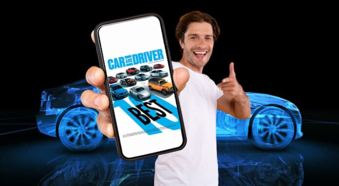A man is shown holding a phone in front of a blue car.