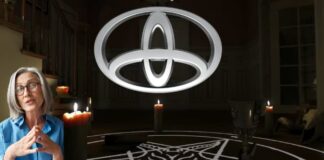 An upside down Toyota logo is shown above a ritual circle at a Toyota dealer.