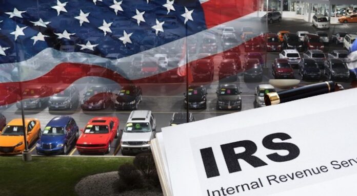 IRS paperwork is shown in front of parked cars.