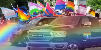 A Ram truck is shown near rainbow flags.