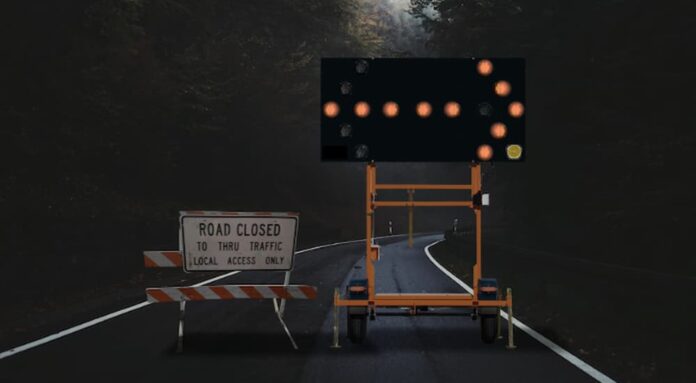 Redirecting you to view a 2023 Nissan Rogue vs 2023 Toyota RAV4 comparison, a road closed sign is shown.