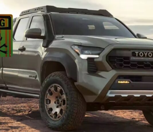 A green 2024 Toyota Tacoma Trailhunter is shown from the front at an angle near a warning sign.