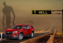A red 2023 Chevy Traverse is shown on the highway to hell being held up by a pig with a large shadowy figure in the background.