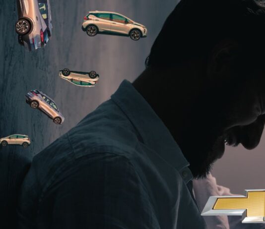 A man is shown with his hand on his forehead as small Chevy Bolt EVs and EUVs float behind him.